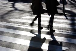 A couple using a crosswalk