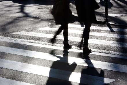 A couple using a crosswalk